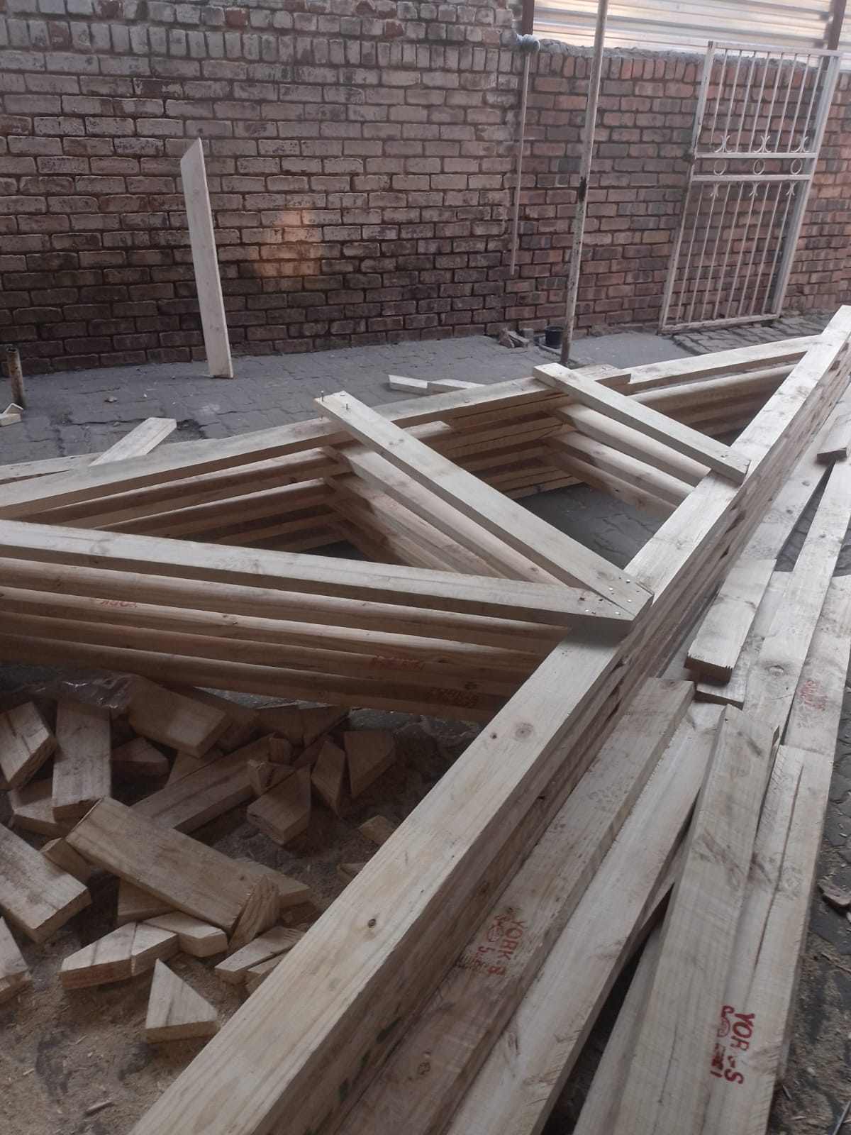 Timber roof trusses prepared for installation